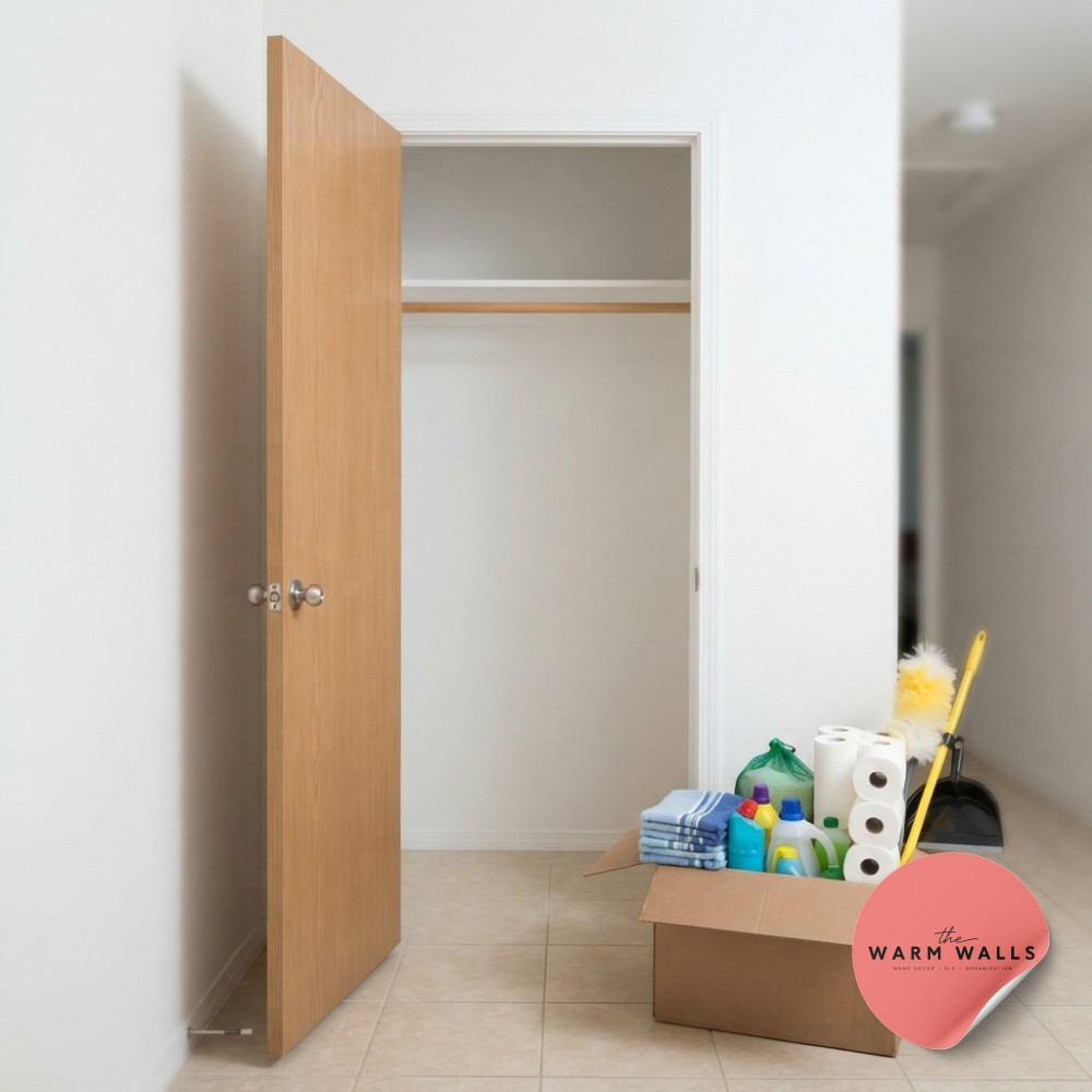 An empty hall closet before hall closet organization shelves, just a bare rod and a box of waiting cleaning supplies